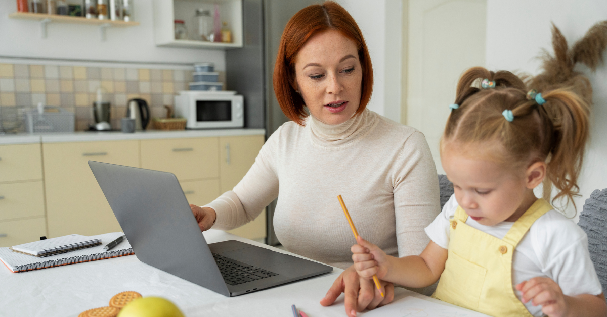software engineer working remotely while taking care of her daughter